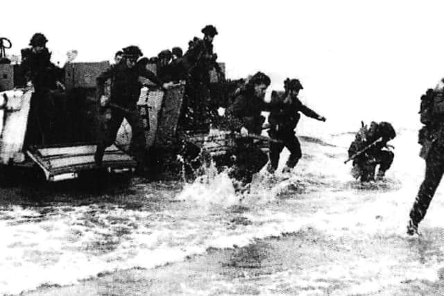 Charge and we see troops landing at Fox Red beach close by Norfolk Crescent, Hayling Island.