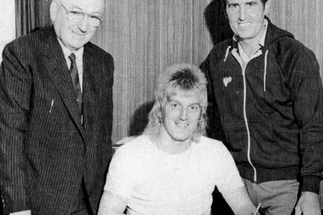 Play up Alan or is it Rod Stewart? With Mr John Deacon and Bobby Campbell looking on Alan Biley signs for Pompey back in 1982.
