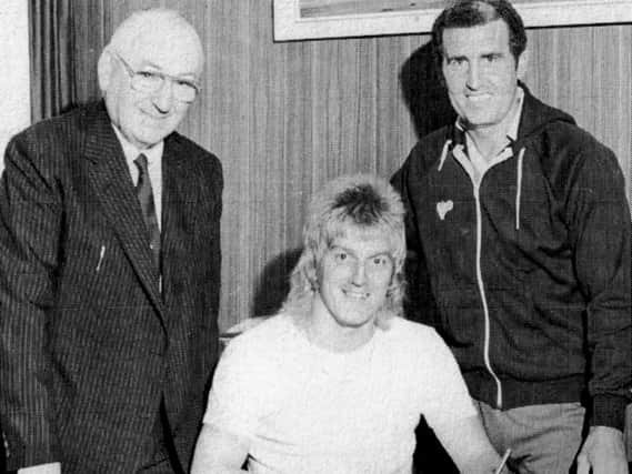 Play up Alan or is it Rod Stewart? With Mr John Deacon and Bobby Campbell looking on Alan Biley signs for Pompey back in 1982.