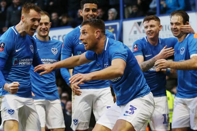 Lee Brown leads the Pompey celebrations following the opener in Saturday's 1-1 FA Cup draw with QPR. Picture: Joe Pepler/Digital South
