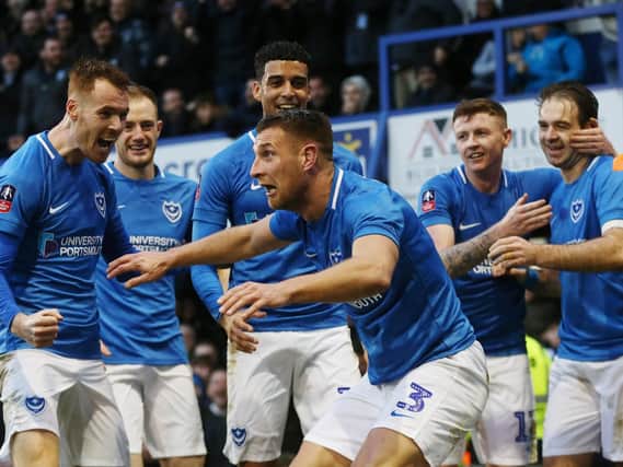 Lee Brown leads the Pompey celebrations following the opener in Saturday's 1-1 FA Cup draw with QPR. Picture: Joe Pepler/Digital South