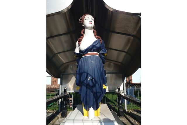 The wooden figurehead from Royal Navy ship HMS Arethusa has been given protected status
Picture: Historic England/PA Wire