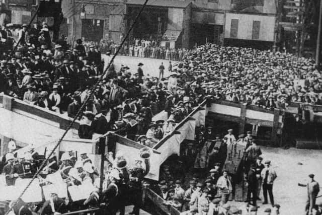 When Portsmouth Dockyard was the largest in the world we see workers and families at the launch of HMS Queen Elizabeth in 1913.