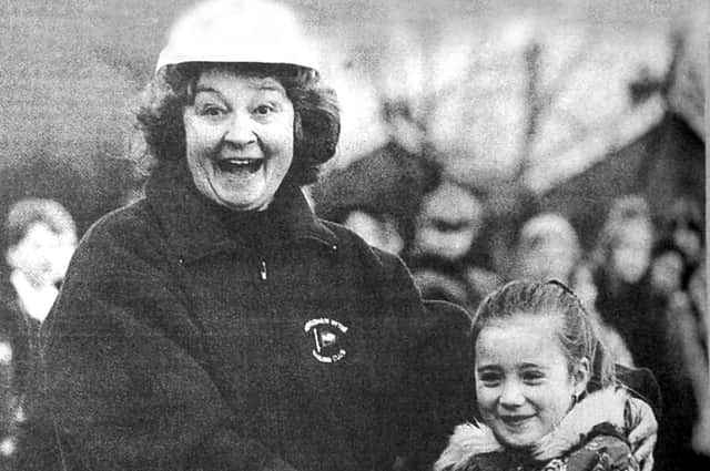 Pictured is former headteacher Ann Tate and Chelsea Jones, aged seven, cutting the first turf of the new junior school.