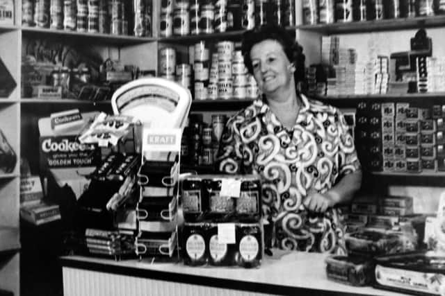 Pictured in her shop at 67, Toronto Road, Landport is Mrs Ethel Morse. Nestles Milk seemed to be popular. Photo: Tony Davis collection.
