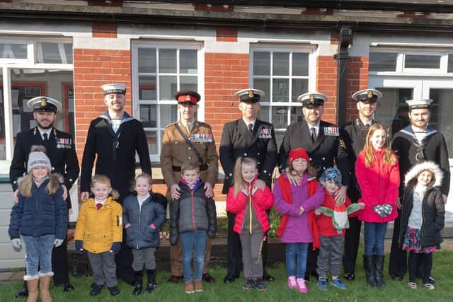 Millitary personnel with their children who attend Brockhurst School. Picture: Keith Woodland (020219-56)