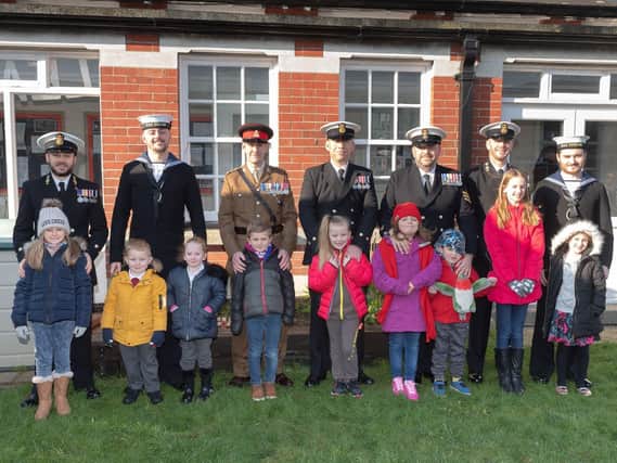 Millitary personnel with their children who attend Brockhurst School. Picture: Keith Woodland (020219-56)