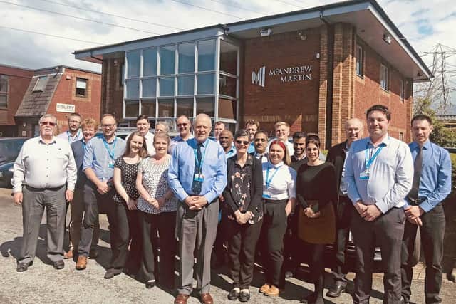 McAndrew Martin staff outside the firm's offices at the Acorn Business Centre in Northarbour Road, Portsmouth. Managing director Bill McAndrew is pictured front centre (blue shirt, brown shoes)