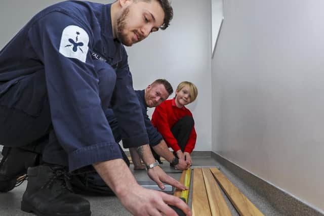 Pupils from Alverstoke Church of England Junior School helping out with the rebuild of the new seats by the swimming pool with Marine Engineer Recce Dalee
Picture: LPhot Barry Swainsbury
