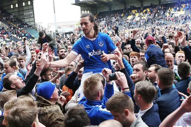 Christian Burgess celebrates Pompey's promotion at Notts County. Picture: Joe Pepler