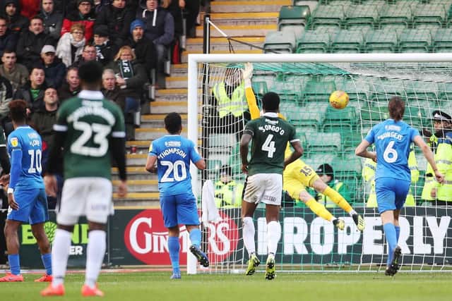 Graham Carey equalises for Plymouth against Pompey. Photo by Joe Pepler/Digital South.