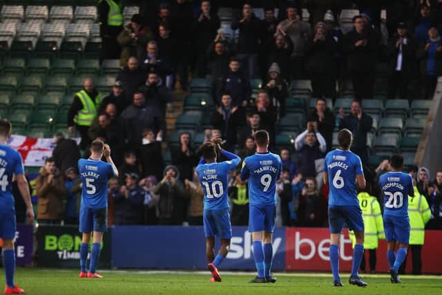 Pompey players applaud their fans after the Plymouth draw. Picture: Joe Pepler