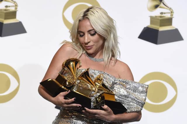 Lady Gaga poses in the press room with her awards at the 61st annual Grammy Awards. Picture: Chris Pizzello/Invision/AP