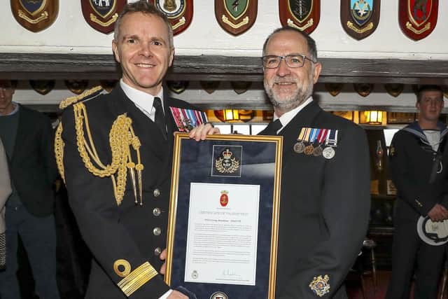 Pictured: Naval Base Commander, Commodore Jim Higham OBE ADC RN presenting Warrant Officer George Boardman RN with is Valediction after serving 42 years in the Royal Navy.
ROYAL NAVAL WARRANT OFFICER RETIRES AFTER SERVING LONGER THAN LORD NELSON
THE ROYAL Navys longest serving Weapon Engineer (WE) Rating, WO George Boardman, will be presented his Valedictory Certificate by the Royal Navys most Senior Naval Officer in the WE branch, Cdre Jim Higham, onboard the longest serving Royal Navy warship, HMS Victory.
WO Boardman joined the Royal Navy in September 1976 as a Junior Engineering Mechanic, completing 42 years and 7 months service thats more time than Lord Nelson.
During his career he has fulfilled a myriad of roles across the Navy and notably in 2007 he was assigned to Iraq for Operation Telic as a Regimental Quarter Master Sergeant.