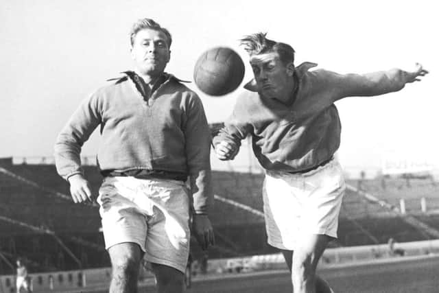 Cousins Jack, left, and Redfern Froggatt, who played for Pompey and Sheffield Wednesday FC, heading the ball during training at the Chelsea ground before they play for England against Wales at Wembley, on November 11 1952. PPP-190802-152758003
