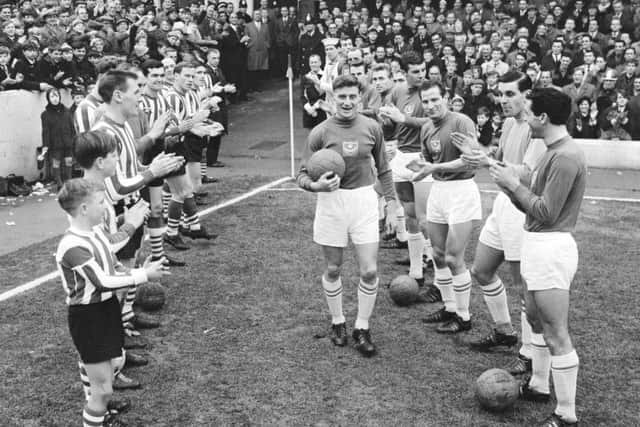 Players from Southampton and Pompey enter the field before a match on January 16 1965. PPP-190802-150405003