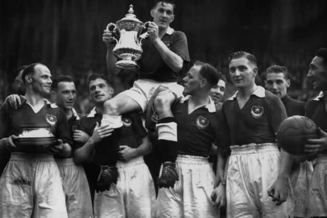 June 5 1939:  Jimmy Guthrie, the Pompey captain, being carried by his team mates after winning the FA Cup final.