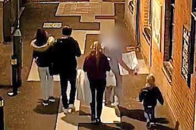 Video grab taken from CCTV issued by the Metropolitan Police of Stephen Waterson and Adrian Hoare (left) with Alfie Lamb (right), with the three other people who were in the car, returning from a shopping trip to Sutton on the day Alfie died. Picture: Metropolitan Police/PA Wire