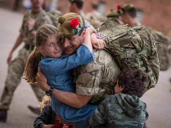 A soldier is welcomed back home after six months in Iraq. Photo: MoD