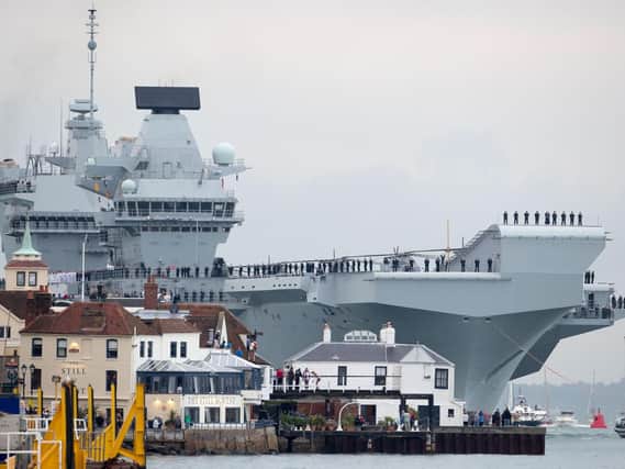 HMS Queen Elizabeth arriving at Portsmouth Harbour. Picture: Steve Parsons/PA Wire