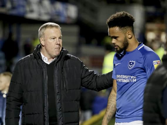 Kenny Jackett consoles Anton Walkes following last night's disappointing 1-1 draw with Bristol Rovers. Picture: Robin Jones/Digital South
