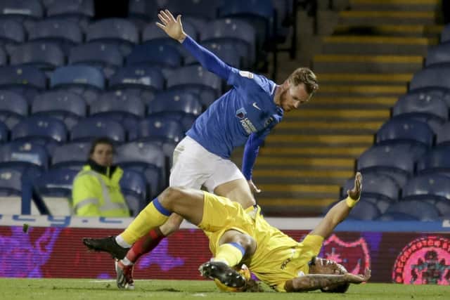 Tom Naylor brings Jonson Clarke-Harris down for a first-half penalty. Picture: Robin Jones/Digital South