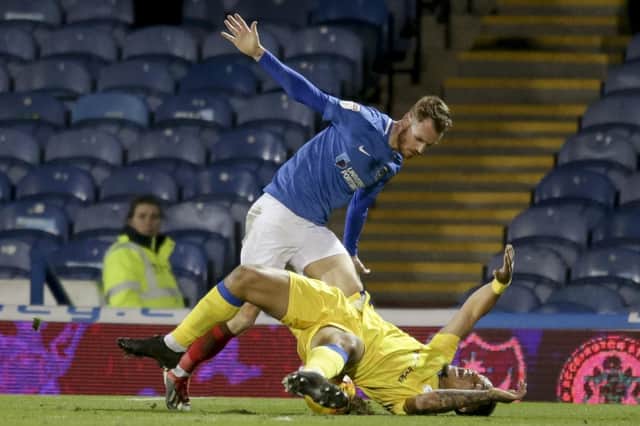Tom Naylor brings Jonson Clarke-Harris down for a first-half penalty. Picture: Robin Jones/Digital South