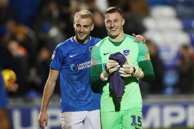 Craig MacGillivray and Jack Whatmough are all smiles after the December 8 victory over Southend - Pompey's last league clean sheet. Picture: Joe Pepler
