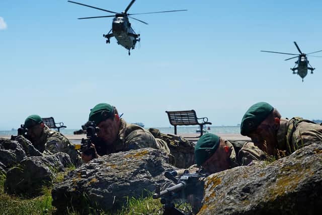 The Royal Marines storm Southsea beach as part of the 70th anniversary of D-Day in 2014 
Picture: L(Phot) Will Haigh