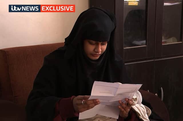 Shamima Begum, 19, in a Syrian refugee camp, being shown a copy of the Home Office letter which stripped her of her British citizenship. Picture: ITV News/PA Wire