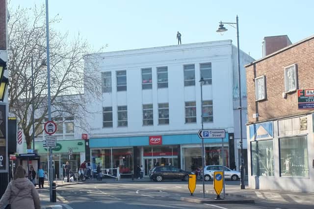 The teenager on the roof of Argos in Commercial Road, Portsmouth. Picture: Solent News & Photo Agency