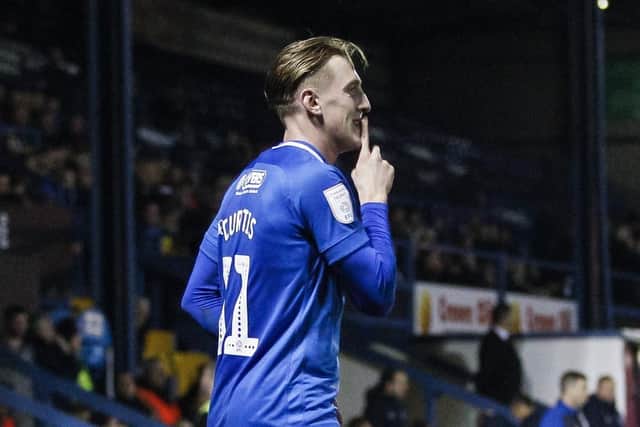 Ronan Curtis celebrates his goal at Bury. Picture: Daniel Chesterton/phcimages.com