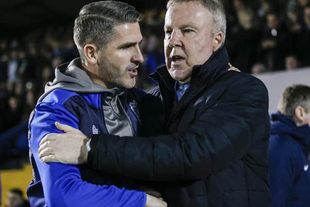 Bury boss Ryan Lowe, left, and Pompey manager Kenny Jackett. Picture: Daniel Chesterton