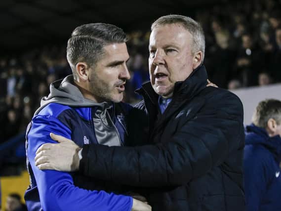 Bury boss Ryan Lowe, left, and Pompey manager Kenny Jackett. Picture: Daniel Chesterton