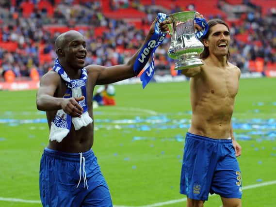 Lassana Diarra and Pedro Mendes celebrate with the FA Cup after Pompey defeated Cardiff in May 2008
