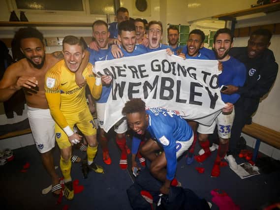 Portsmouth celebrate in the changing room after winning the Checkatrade Trophy Semi Final match between Bury and Portsmouth at Gigg Lane on February 26th 2019 in Bury, England. (Photo by Daniel Chesterton/phcimages.com)