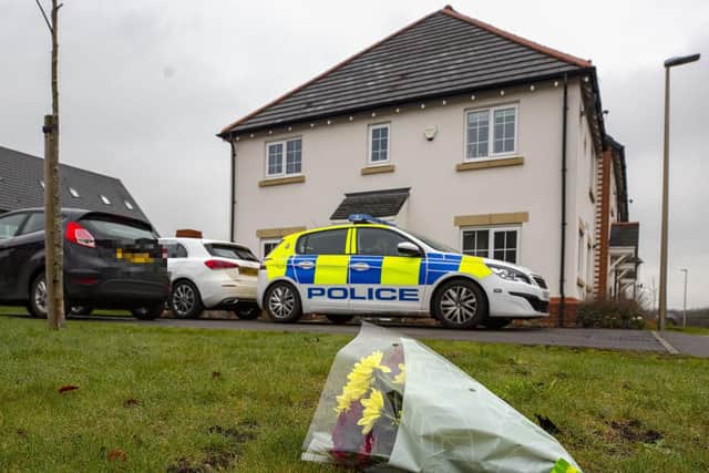 Flowers left on Fleming Court in the Shevington area of Wigan, following the arrest of a 32-year-old man on suspicion of murder a baby girl died. Picture: Peter Byrne/PA Wire