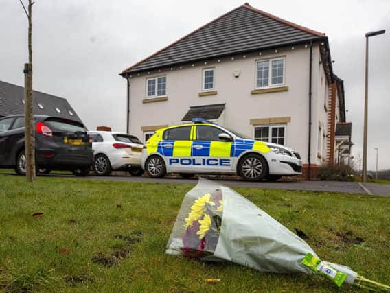 Flowers left on Fleming Court in the Shevington area of Wigan, following the arrest of a 32-year-old man on suspicion of murder a baby girl died. Picture: Peter Byrne/PA Wire