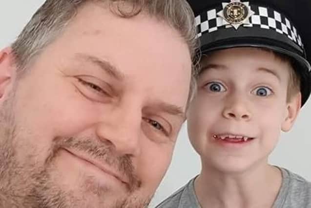 PC Mike Harvey with seven-year-old James Glass after helping him overcome his fear of police. Picture: Family handout/Sussex Police/PA Wire