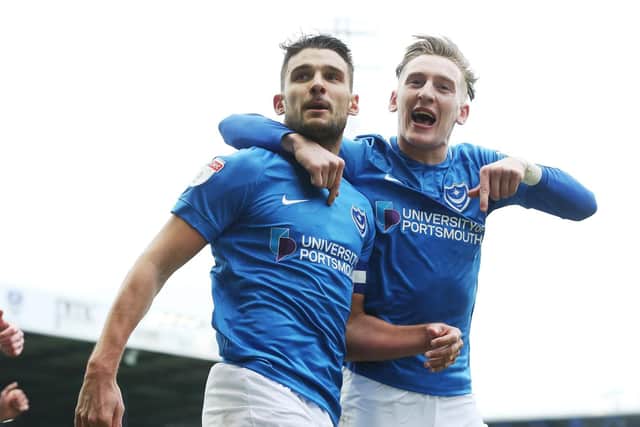 Gareth Evans, left, and Ronan Curtis celebrate after Pompey break the deadlock against Bradford. Picture: Joe Pepler
