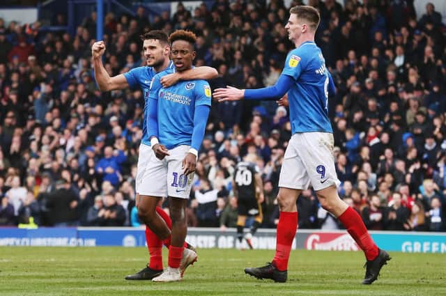 Pompey celebrate Jamal Lowe's goal against Bradford - two minutes after Hope Akpan had netted for the visitors. Picture: Joe Pepler