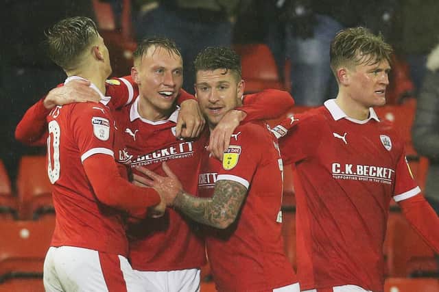 Cauley Woodrow (centre, left) netted in 10-man Barnsley's win at Southend