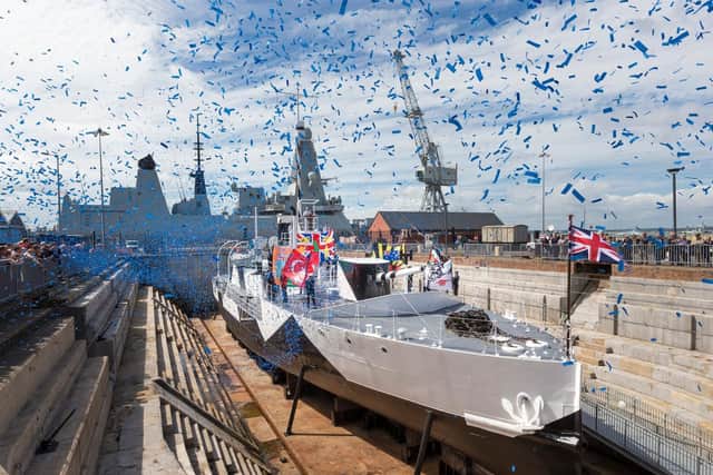 Confetti flutters over HMS M.33 at Portsmouth Historic Dockyard when she was officially reopened and rededicated at The National Museum of the Royal Navy . 
Picture by Christopher Ison.