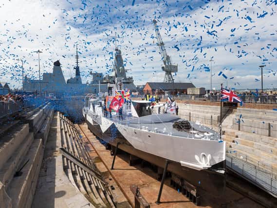 Confetti flutters over HMS M.33 at Portsmouth Historic Dockyard when she was officially reopened and rededicated at The National Museum of the Royal Navy . 
Picture by Christopher Ison.