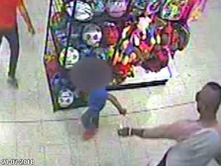 Screengrab taken from CCTV footage  of the moment Adam Cech (bottom left) sprayed a three-year-old boy (blue T-shirt) with acid in an attack in a Home Bargains store in Worcester. Picture: West Mercia Police/PA Wire