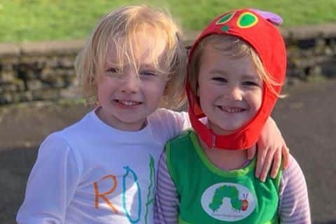 Bertie Venn, 3, and Martha Howell, 4, as George Pig and The Very Hungry Caterpillar respectively at Clanfield Primary School