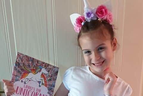 Evie-Louise Skittlethorpe, 7, from Gosport has gone as a unicorn for World Book Day