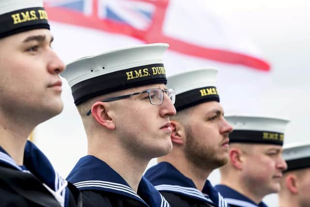 Sailors from HMS Duncan line the upperdeck for Procedure Alpha as the type 45 destroyer sets sail from Portsmouth. Photo: LPhot Ben Corbett