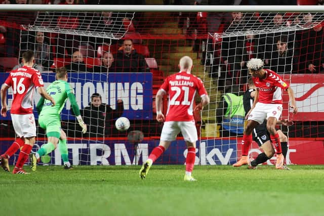 Lyle Taylor grabs Charlton's winner against Pompey. Picture: Joe Pepler