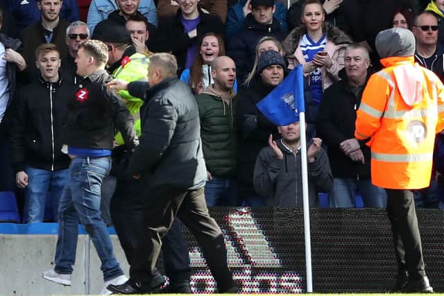 Paul Mitchell (left, on pitch, blue jeans) has been jailed for 14 weeks after attacking Aston Villa captain Jack Grealish. Picture : Nick Potts/PA Wire